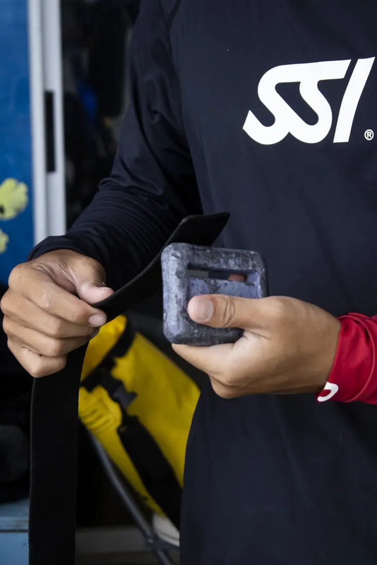 Our instructor in an SSI shirt checking a piece of gear